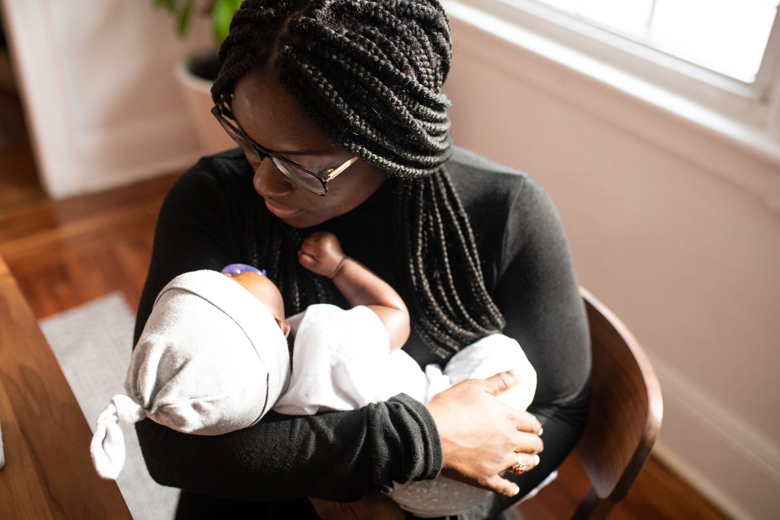 A mother holding her newborn